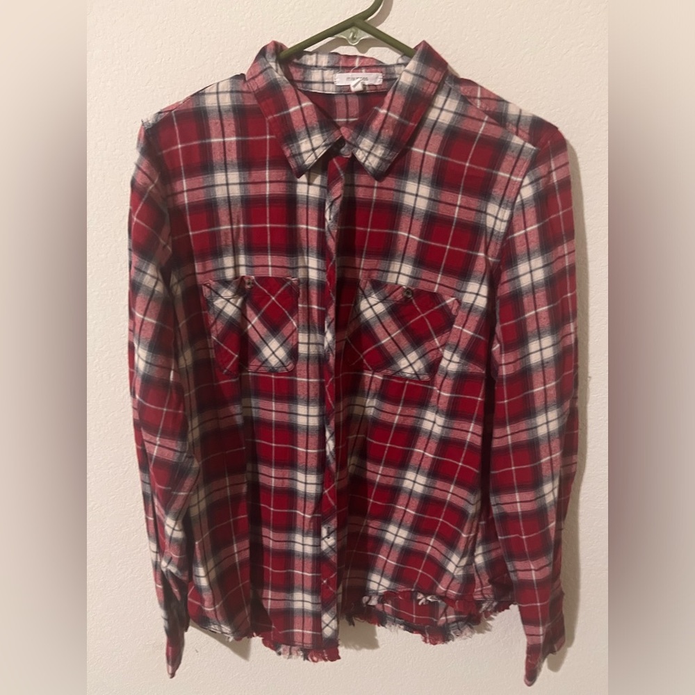 Plaid button down shirt.